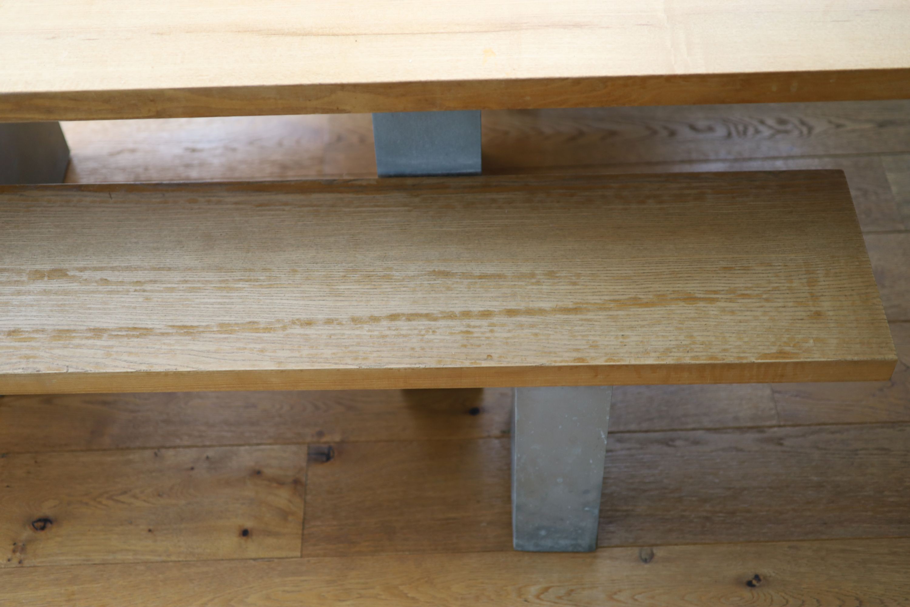 A contemporary oak kitchen table with pair of matching benches and oxidised metal supports, table width 230cm depth 90cm height 74cm, benches width 180cm
